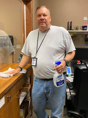 Judge Dunn cleaning surfaces in the Courthouse to help protect the public and court employees. 